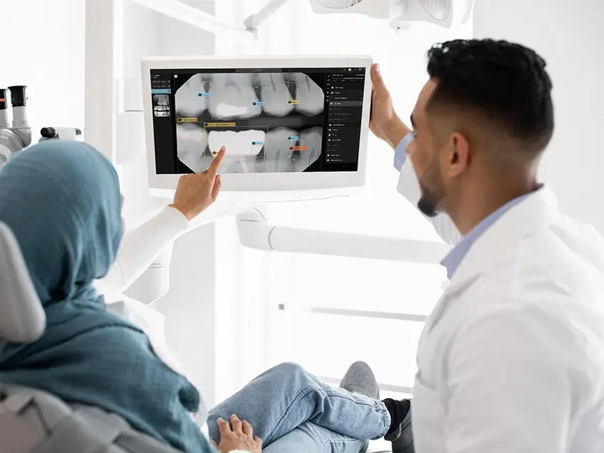 dentist showing radiology to patients